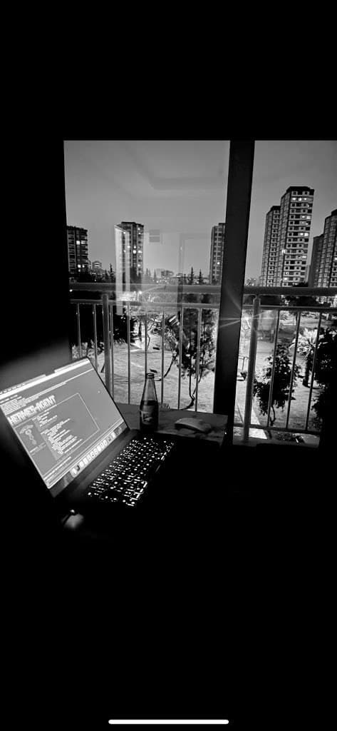 The founder working late on a balcony at night